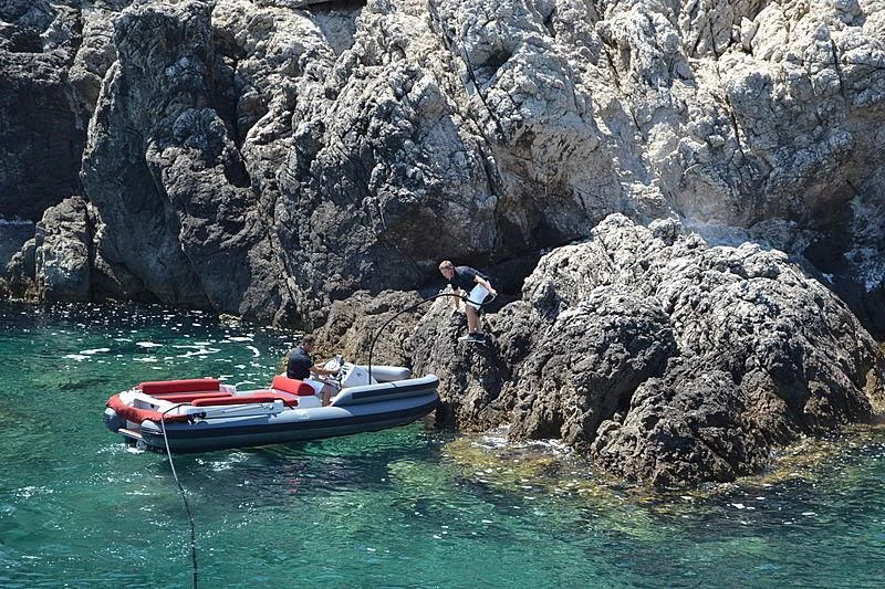 a couple of people on a boat in the water aboard RL NOOR Yacht for Sale