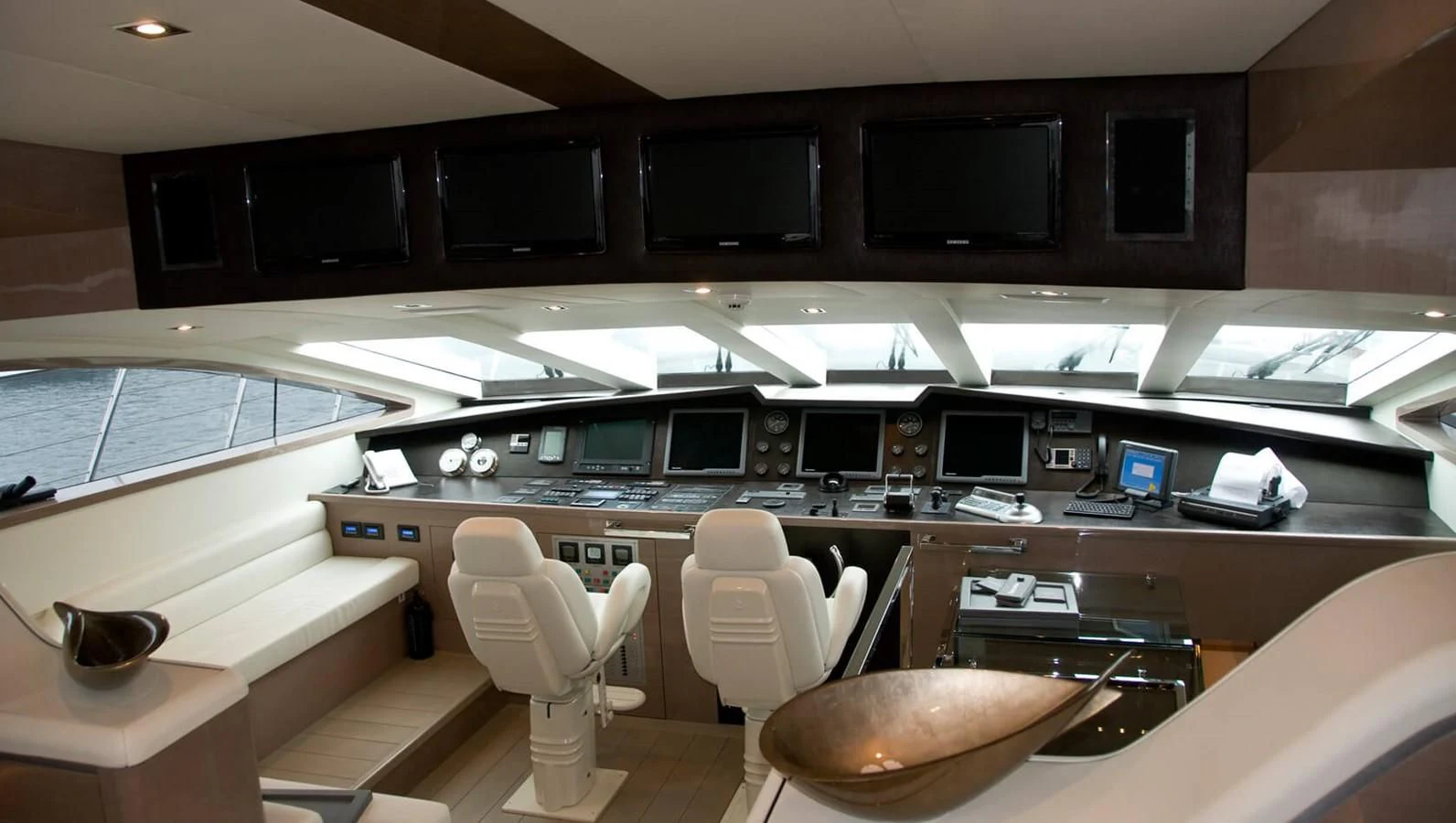 a room with a table and chairs aboard RL NOOR Yacht for Sale