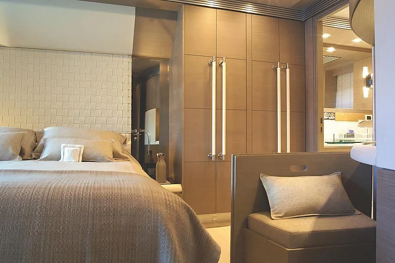 a room with a bed and a chair aboard RL NOOR Yacht for Sale