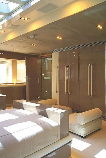 a room with a bed and a desk aboard RL NOOR Yacht for Sale