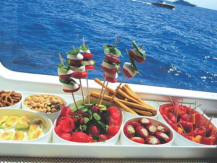a table with food on it aboard RL NOOR Yacht for Sale