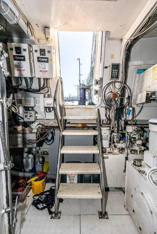 a room with a ladder and equipment aboard HISTORY Yacht for Sale