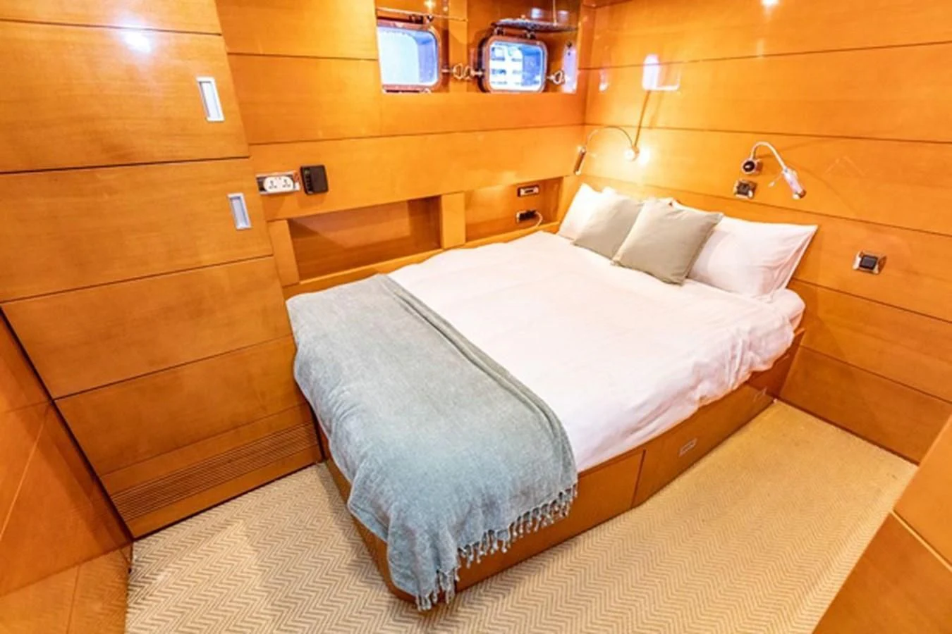 a bed in a room aboard HISTORY Yacht for Sale