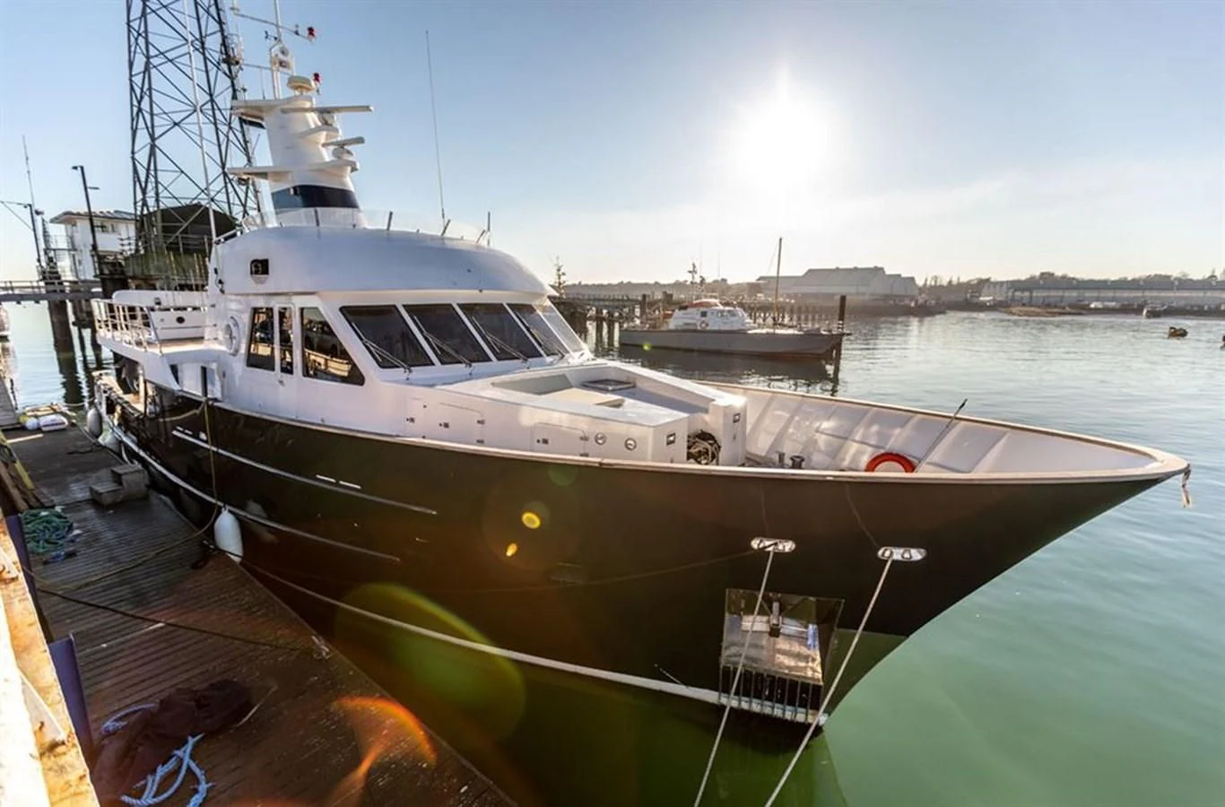 a large white boat docked aboard HISTORY Yacht for Sale