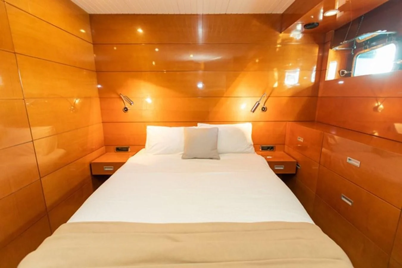a bed with white sheets aboard HISTORY Yacht for Sale