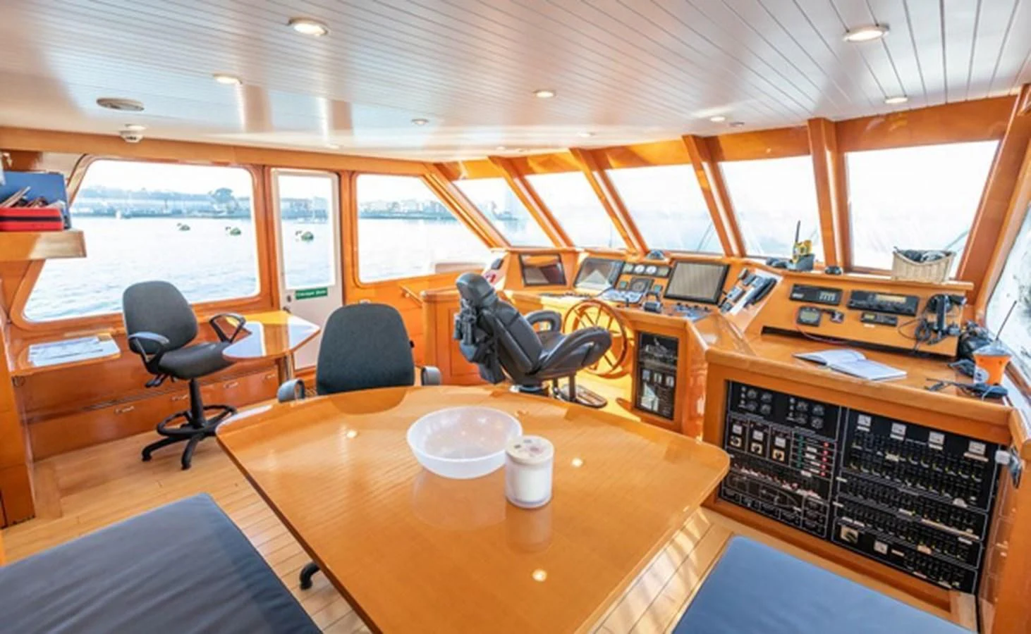 a room with a table and chairs aboard HISTORY Yacht for Sale