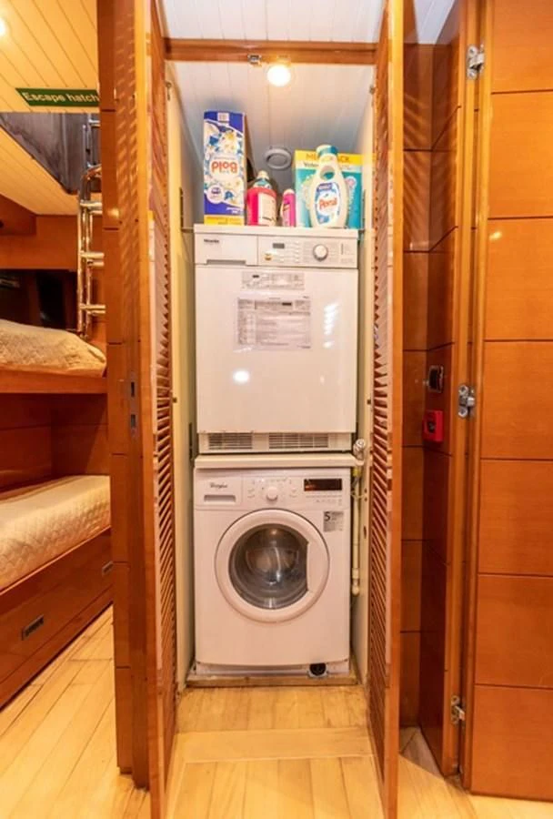 a washer and dryer in a room aboard HISTORY Yacht for Sale