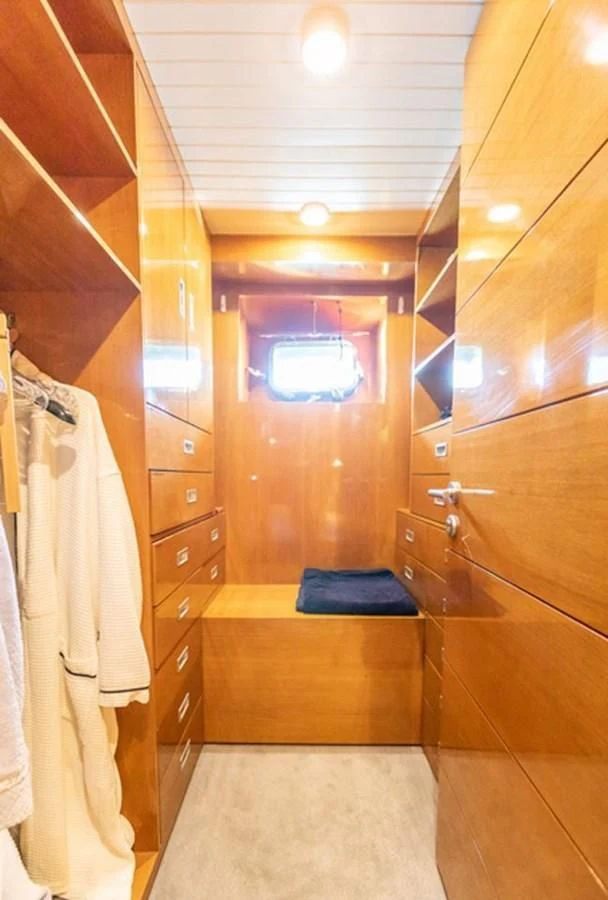 a bathroom with a wooden door aboard HISTORY Yacht for Sale
