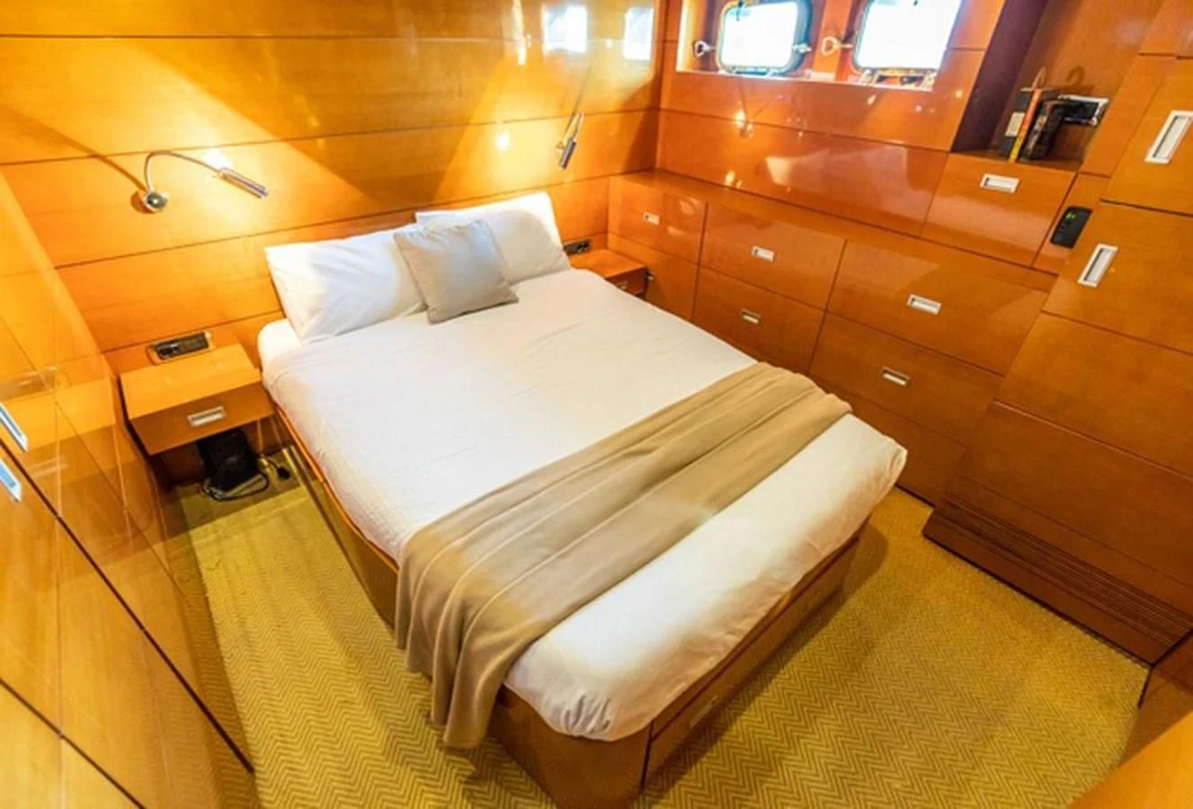 a bed in a room aboard HISTORY Yacht for Sale