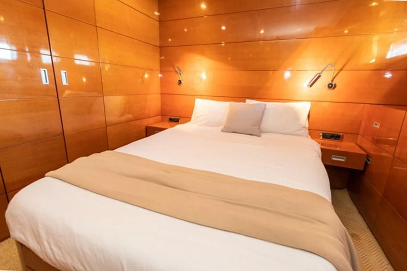 a bed with white sheets aboard HISTORY Yacht for Sale