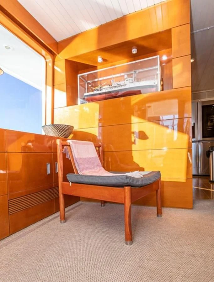 a chair in a room aboard HISTORY Yacht for Sale