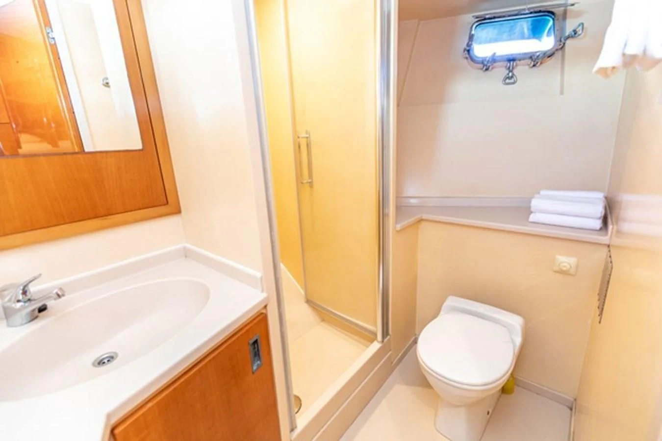 a bathroom with a toilet and sink aboard HISTORY Yacht for Sale