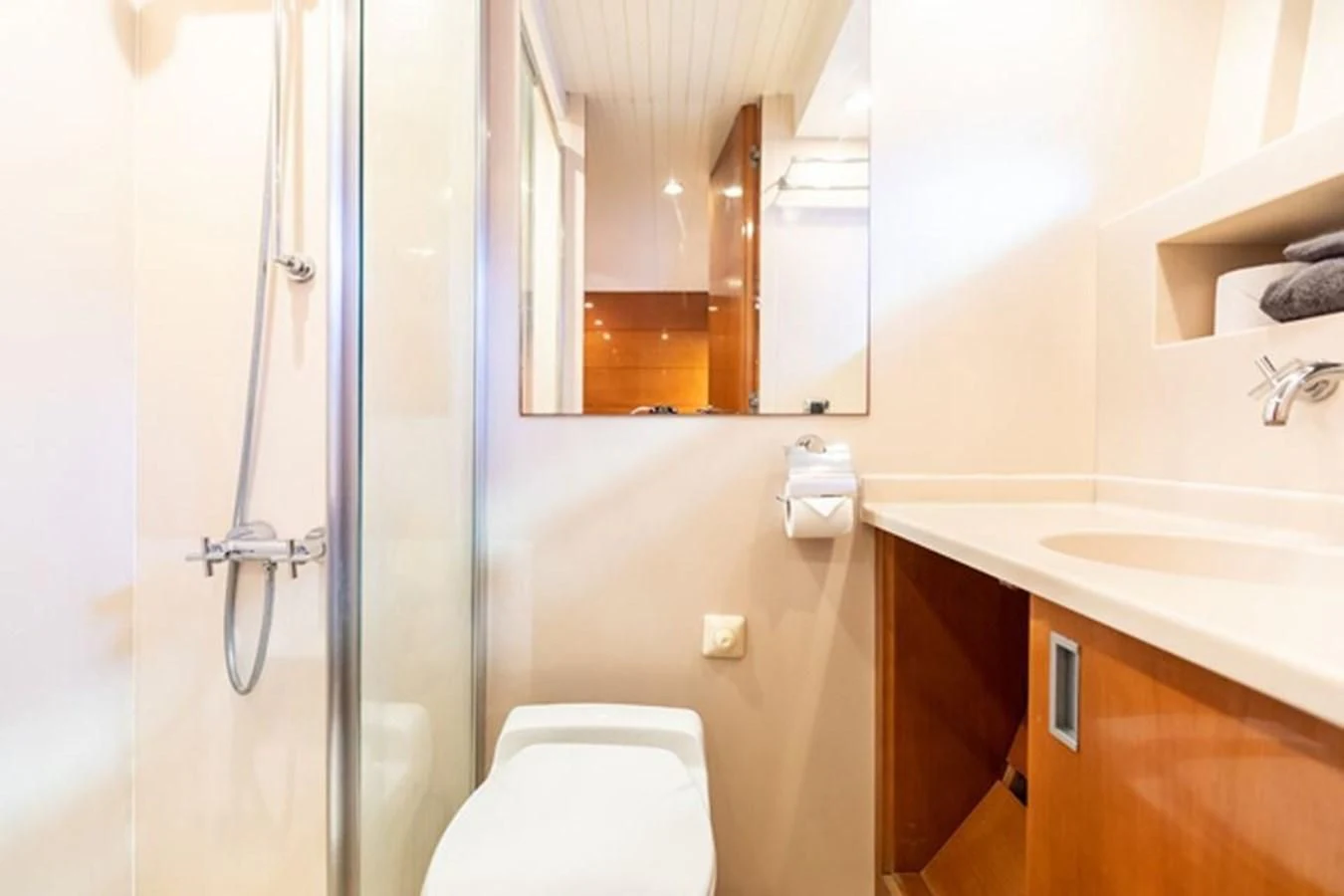 a bathroom with a glass shower door aboard HISTORY Yacht for Sale