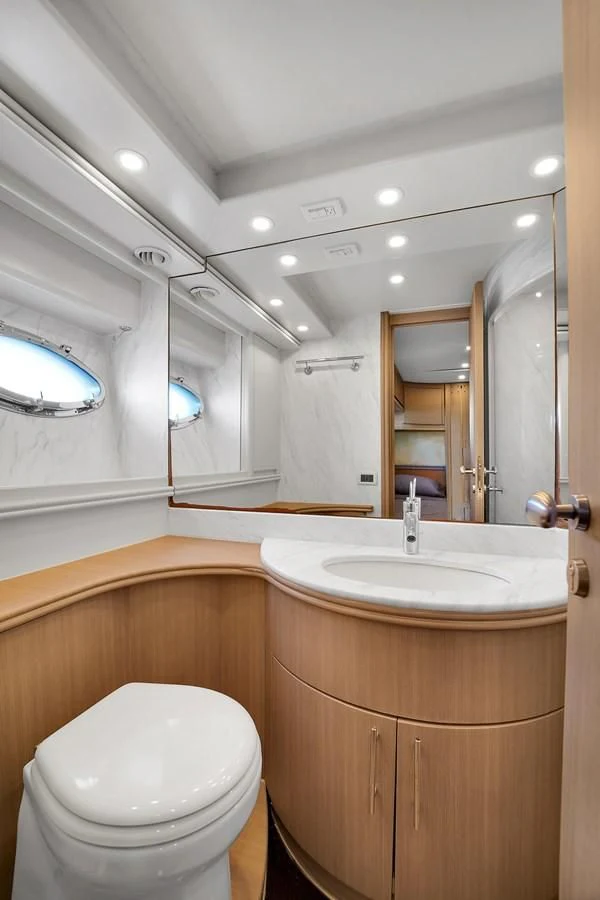 a bathroom with a toilet and a sink aboard PERSHING 88/07 Yacht for Sale
