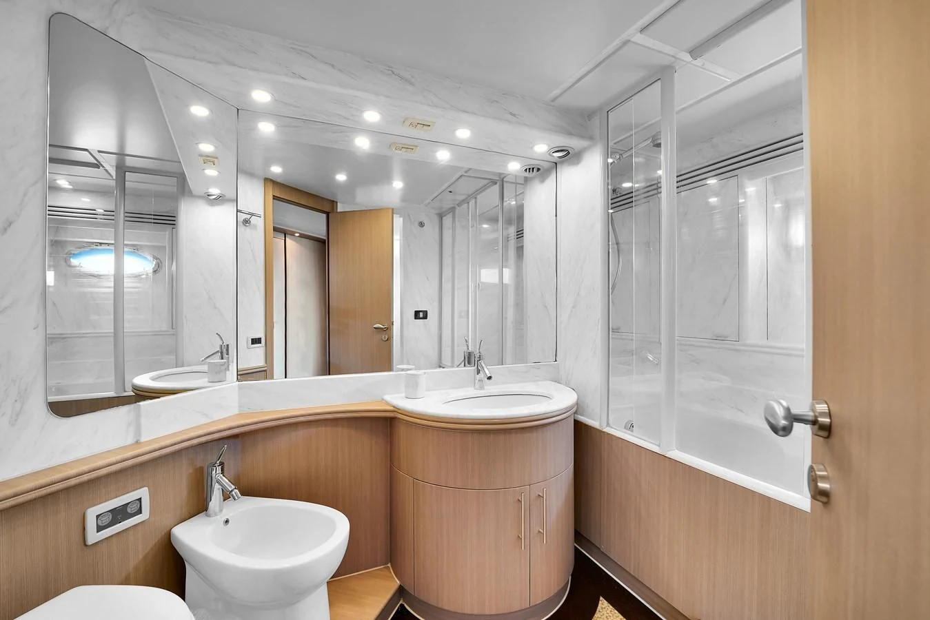 a bathroom with a large mirror aboard PERSHING 88/07 Yacht for Sale