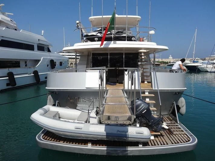 a boat with a red stripe on the front aboard ANTISAN Yacht for Charter