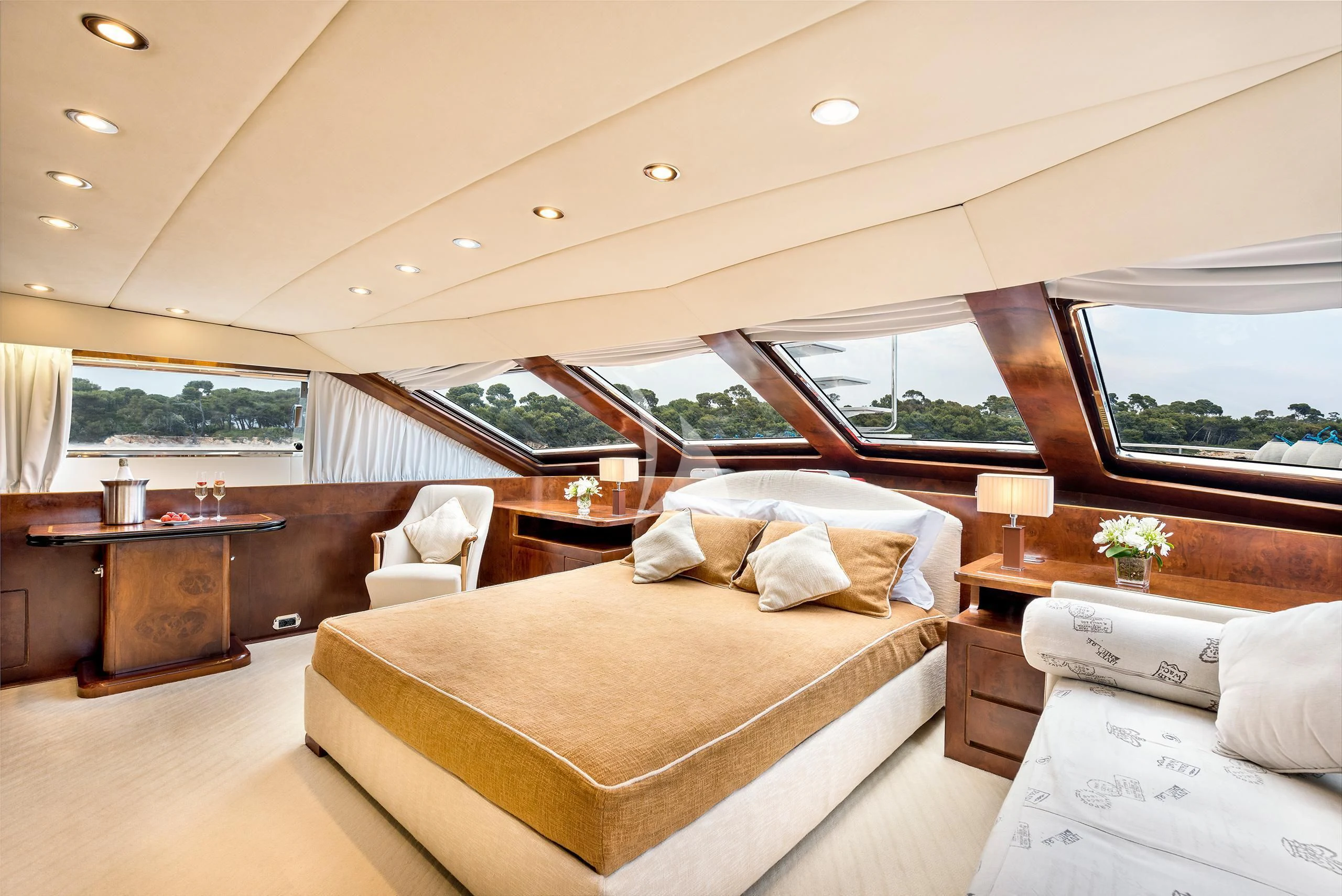 a room with a bed and a window aboard ANTISAN Yacht for Charter