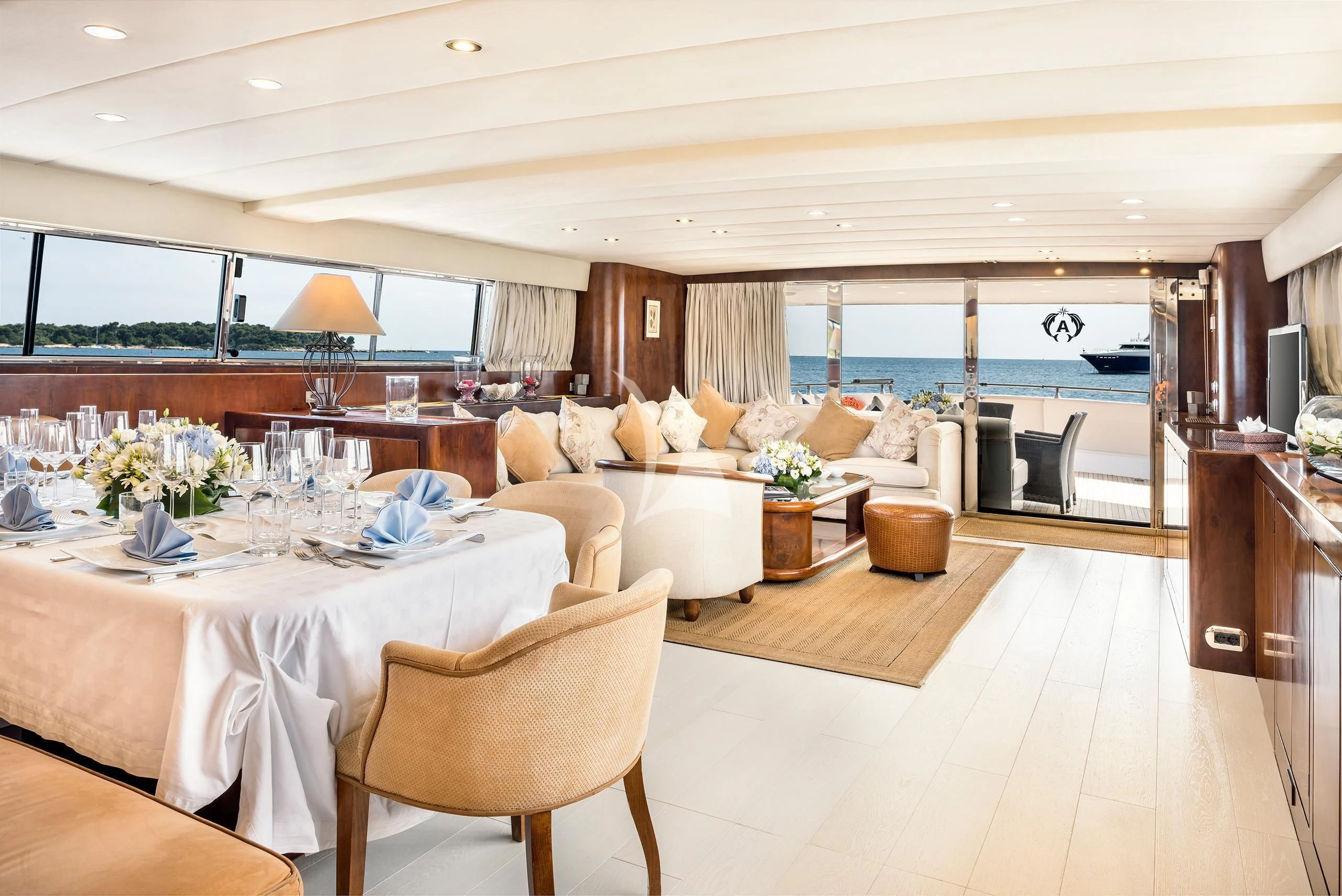 a large living room with a large balcony aboard ANTISAN Yacht for Charter