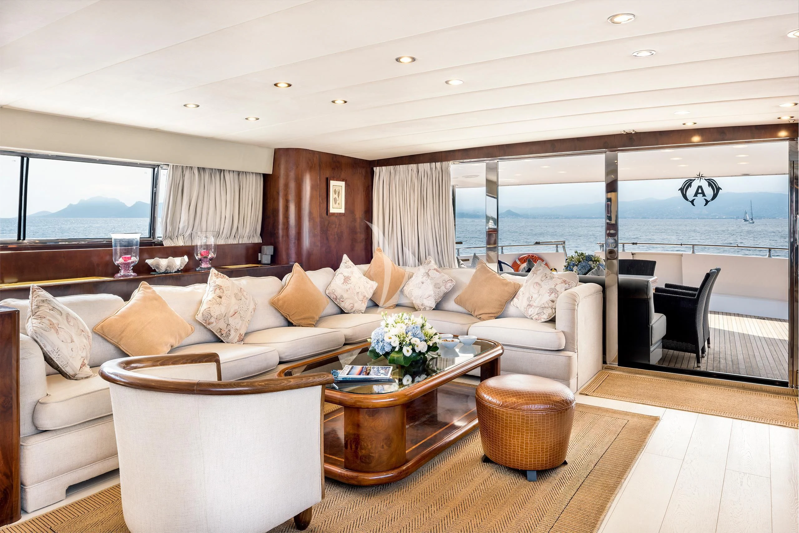 a living room with a large window aboard ANTISAN Yacht for Charter