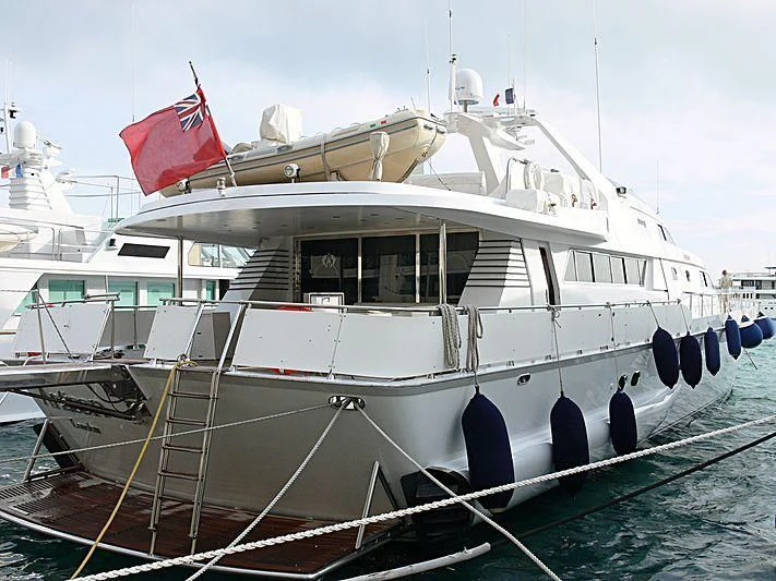 a boat with a flag on the front aboard ANTISAN Yacht for Charter