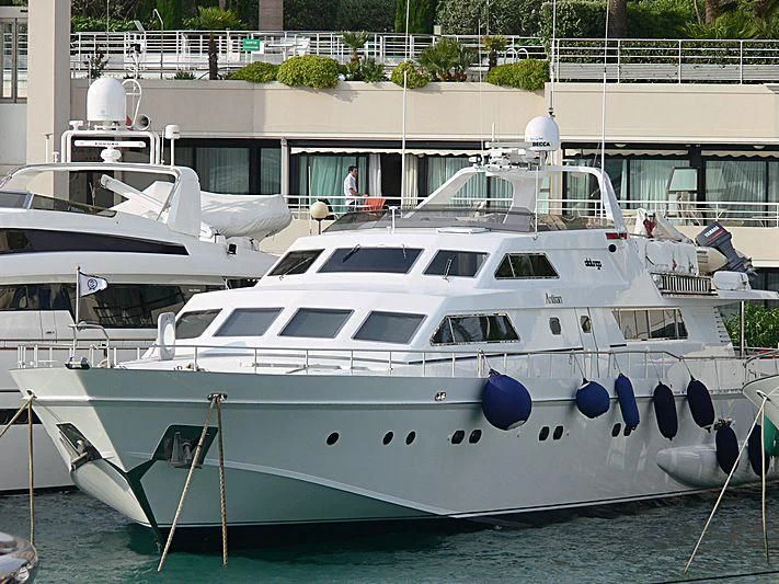 a white yacht docked aboard ANTISAN Yacht for Charter