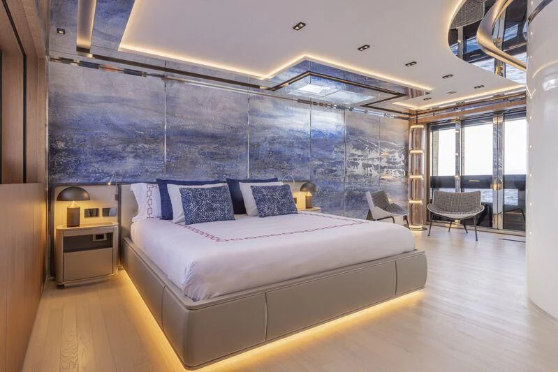 a large bed in a room aboard ARIA SF Yacht for Sale