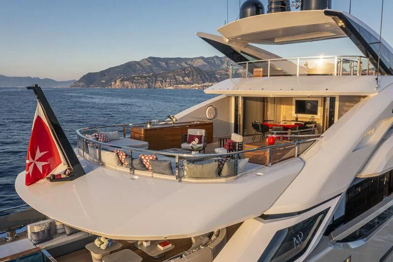 a boat with a flag on the front aboard ARIA SF Yacht for Sale
