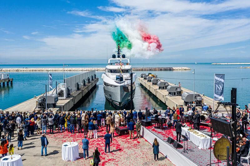 a crowd of people at a beach aboard ARIA SF Yacht for Sale