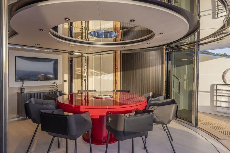 a room with a table and chairs aboard ARIA SF Yacht for Sale