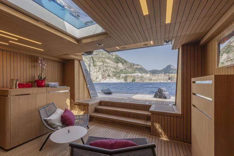 a room with a view of the ocean and mountains aboard ARIA SF Yacht for Sale