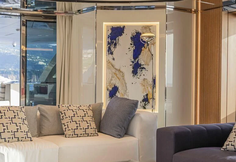 a living room with a painting aboard ARIA SF Yacht for Sale