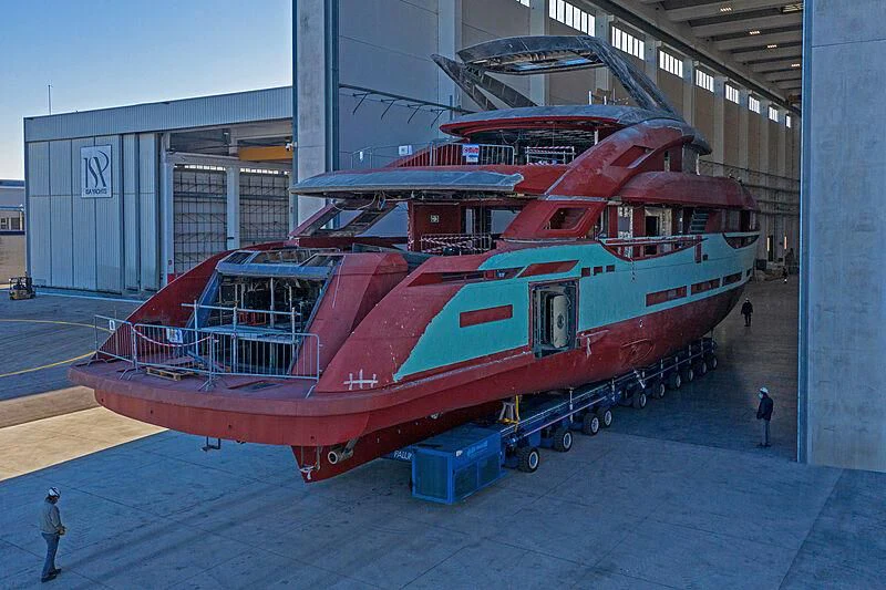 a large red boat in a warehouse aboard ARIA SF Yacht for Sale