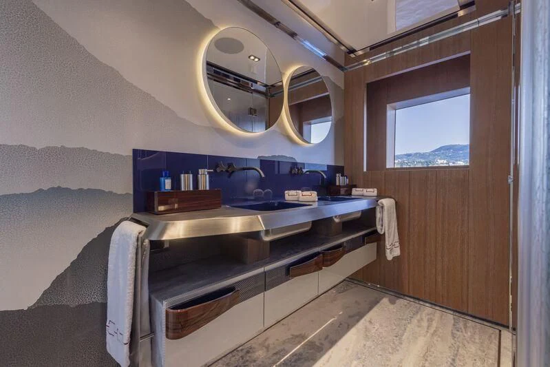 a bathroom with a large mirror aboard ARIA SF Yacht for Sale