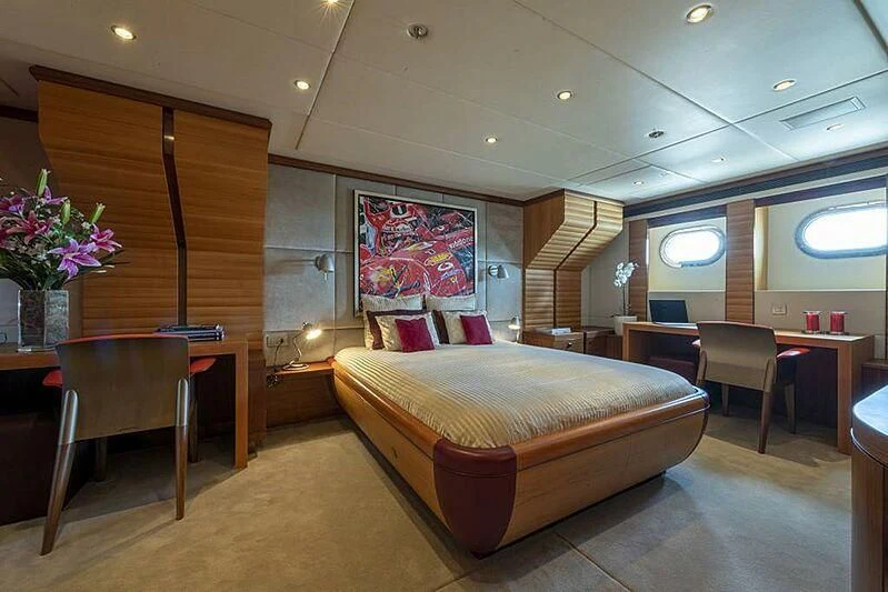 a hotel room with a bed and desk aboard SPACE Y Yacht for Sale