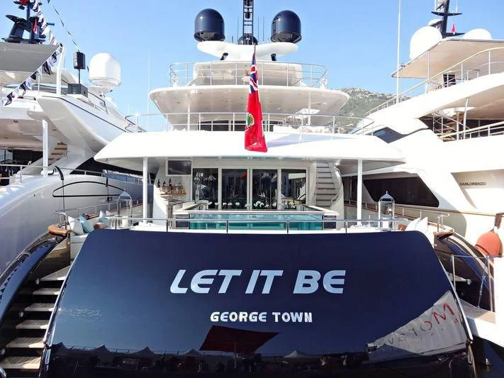 a boat with a flag on the front aboard SPACE Y Yacht for Sale