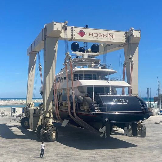 a large boat on a trailer aboard SPACE Y Yacht for Sale