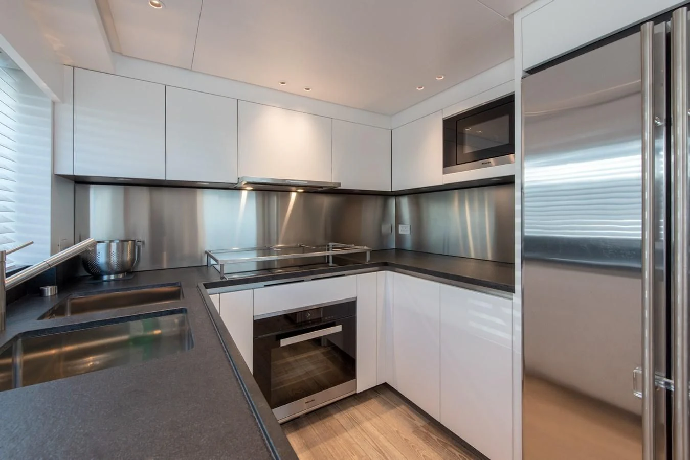 a kitchen with stainless steel appliances aboard VICKY Yacht for Sale