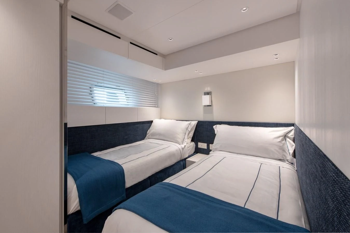 a room with two beds aboard VICKY Yacht for Sale