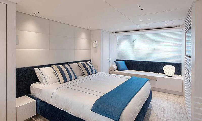 a room with a bed and a window aboard VICKY Yacht for Sale