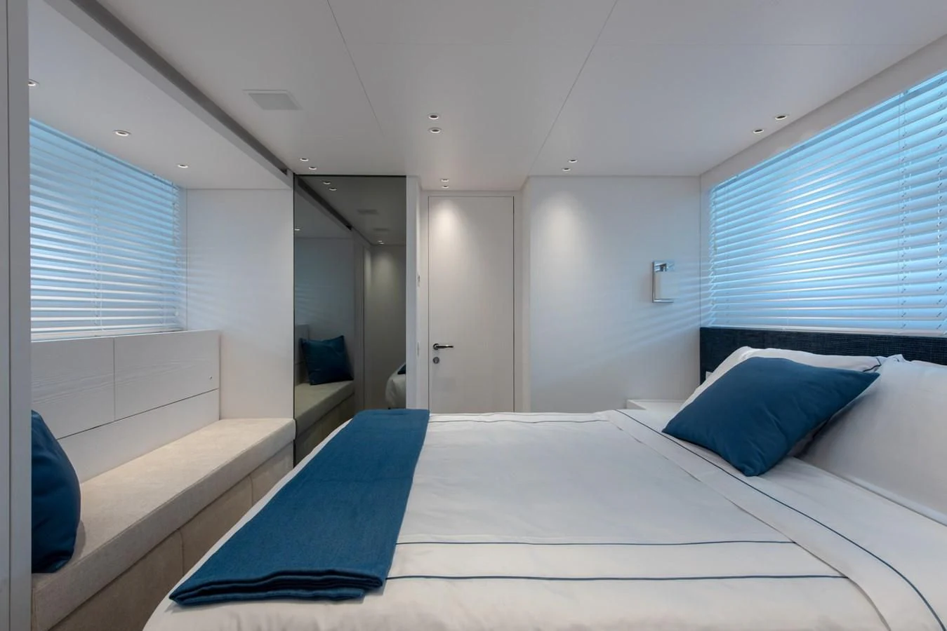 a bedroom with a bed and a couch aboard VICKY Yacht for Sale
