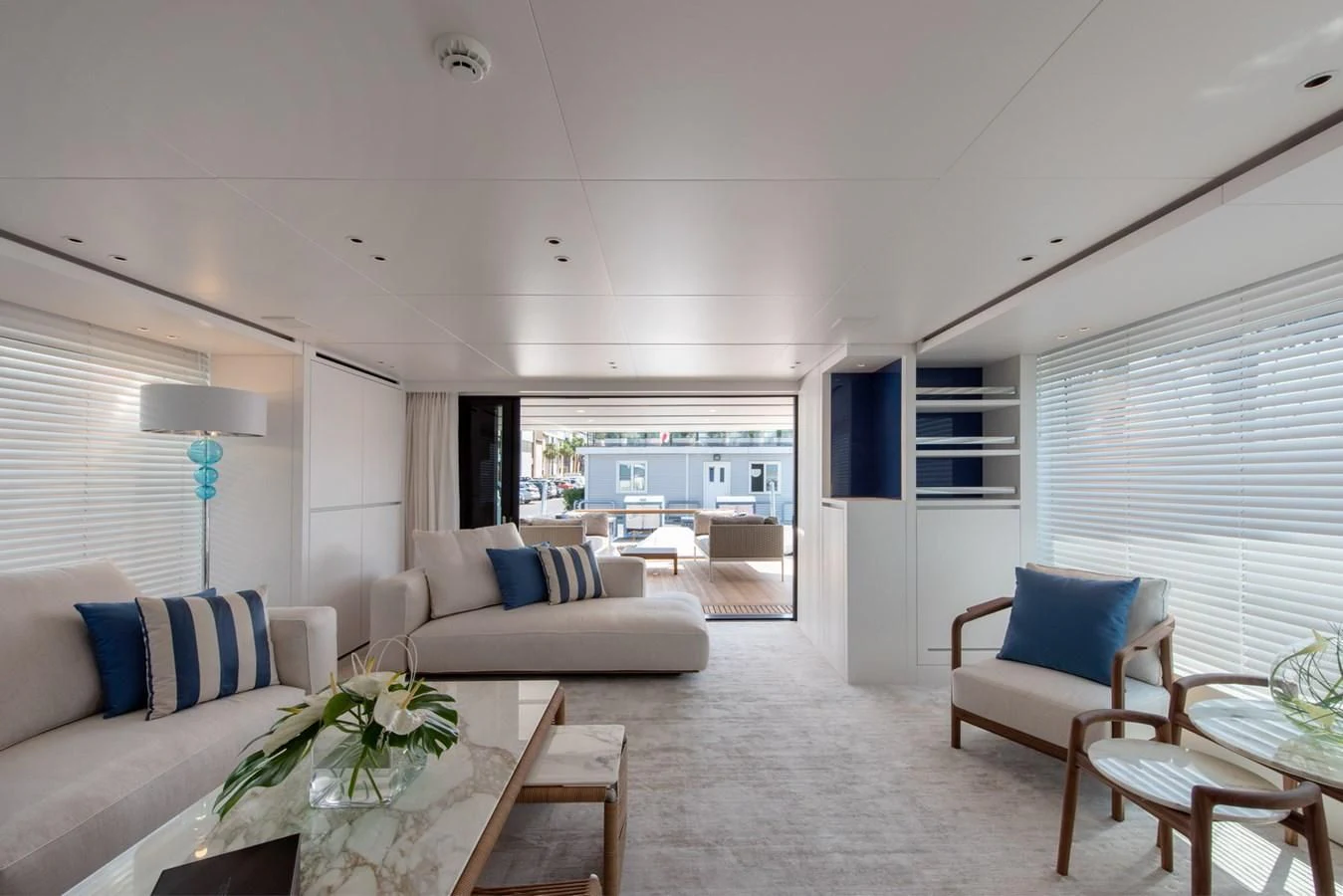 a living room with a couch and a table aboard VICKY Yacht for Sale