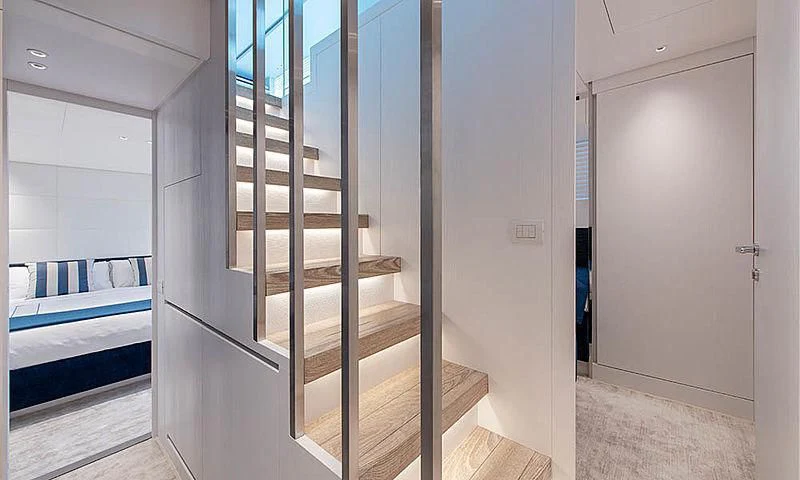 a room with a bed and a closet aboard VICKY Yacht for Sale