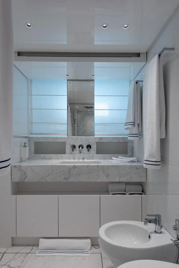 a bathroom with a sink and a mirror aboard VICKY Yacht for Sale