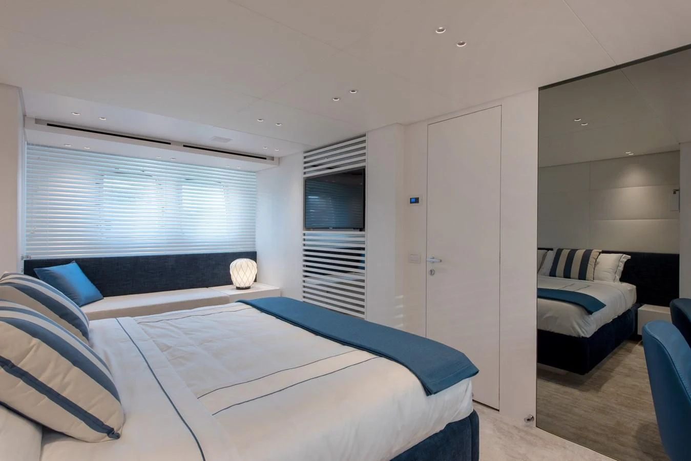 a bedroom with a bed and a couch aboard VICKY Yacht for Sale