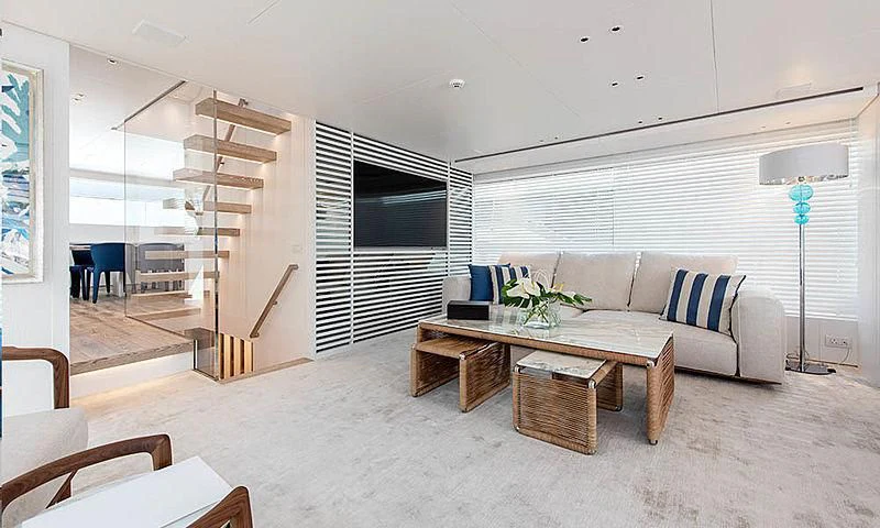 a living room with a couch and a table aboard VICKY Yacht for Sale