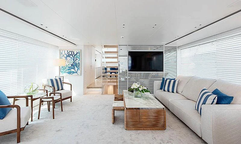a living room with a couch and a television aboard VICKY Yacht for Sale
