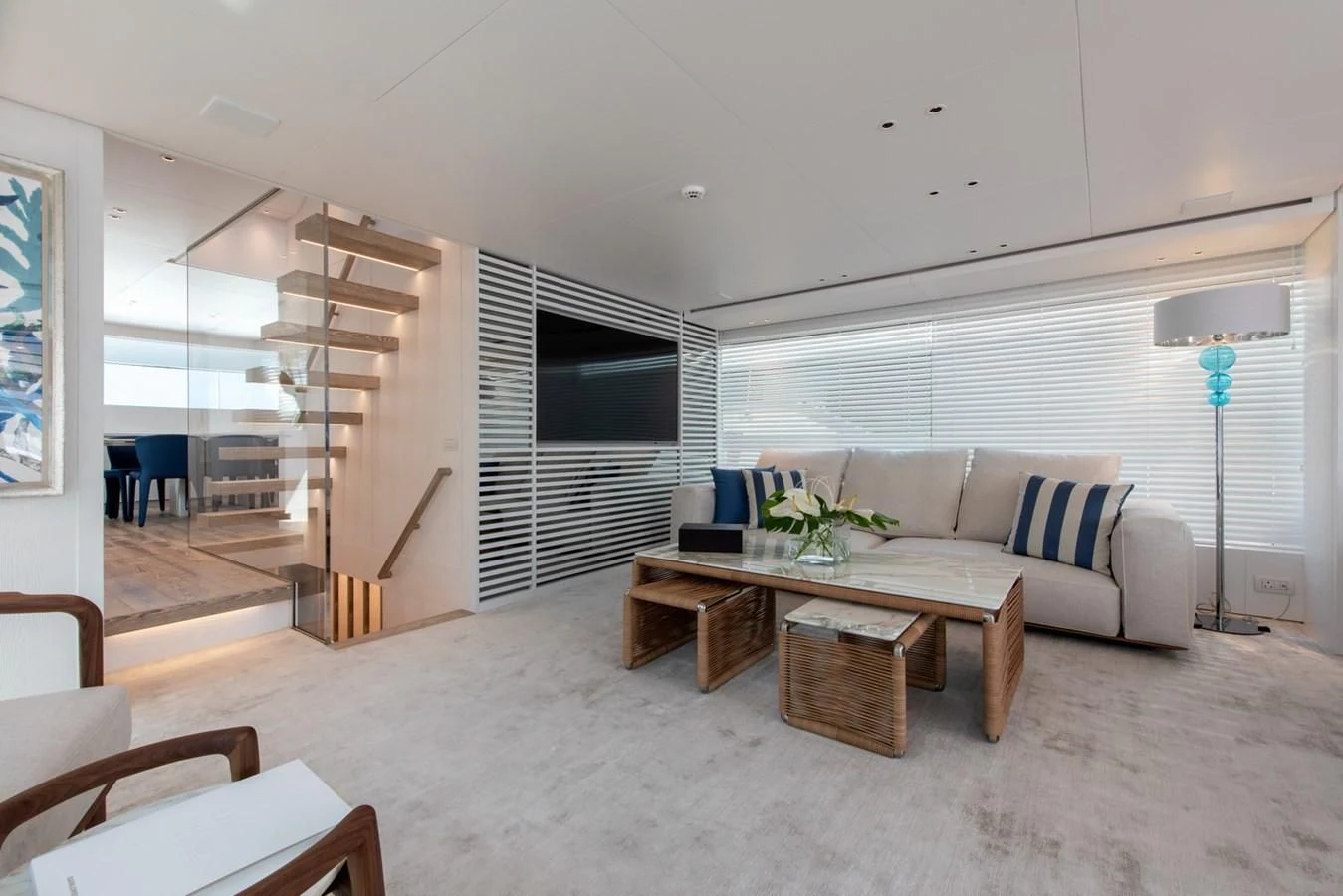 a living room with a couch and a table aboard VICKY Yacht for Sale