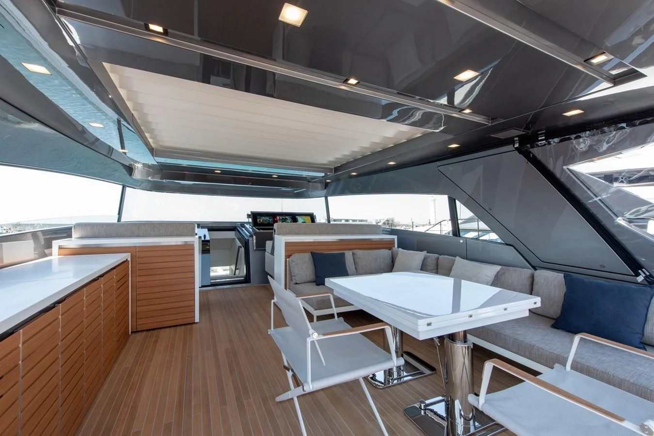 a room with tables and chairs aboard VICKY Yacht for Sale
