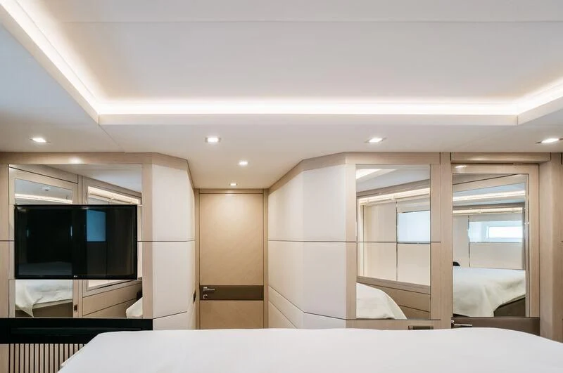 a room with a tv and a closet aboard LEMANJA Yacht for Sale