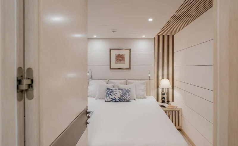 a bed with a white sheet aboard LEMANJA Yacht for Sale